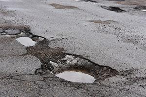 Ditch and Pothole Accident