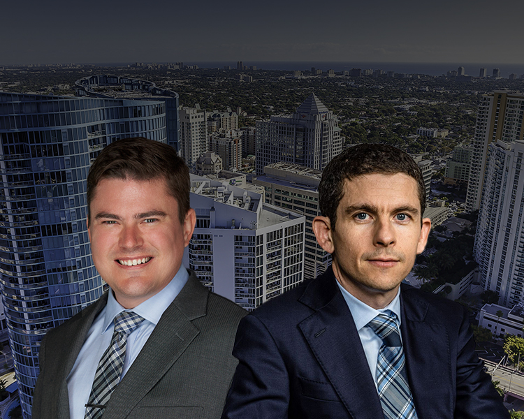 Group photo of the Anthony Quackenbush, Esq. with the Fort Lauderdale skyline in the background.