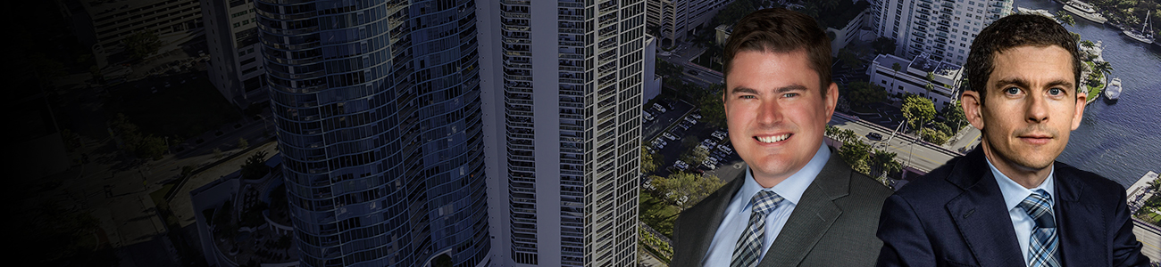 Group photo of the Anthony Quackenbush, Esq. with the Fort Lauderdale skyline in the background.